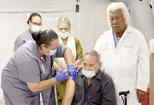 Gov. Lolo Matalasi Moliga receiving COVID-19 vaccine