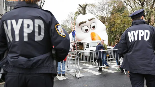 Police standing watch a day before the Thanksgiving Day parade