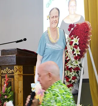  Territorial Bank of American Samoa (TBAS) president and chief executive officer David Muhler with photos of Makerita T. Polu in the background