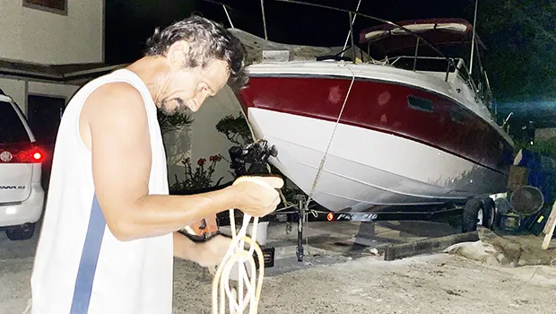 Harry Calistro Jr, ties down his 27' fishing boat