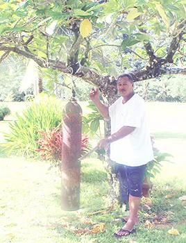A Pago Pago villager ringing the curfew bell