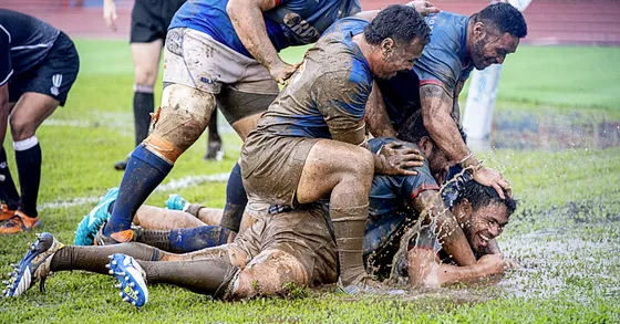 Muddy conditions on the field during Samoa vs Tonga rugby match