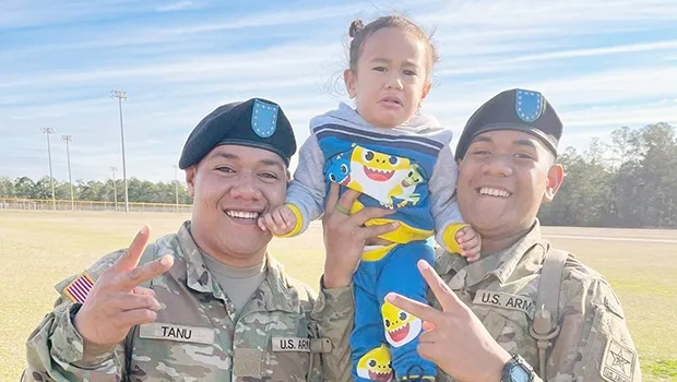 PVT Fa’amagalo Tanu and PVT Sene Jr Isileli with their nephew Jelsen