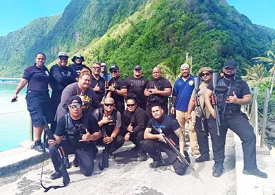 DPS officers posing in Ofu, Manu'a after drug raid in June 2020