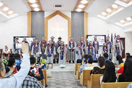 The fourteen graduates of Manumalo Academy 