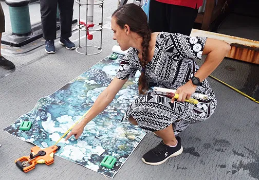Crew member showing ocean floor mapping