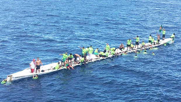 The Matasaua crew awaiting help to arrive after their fautasi took on water last Saturday