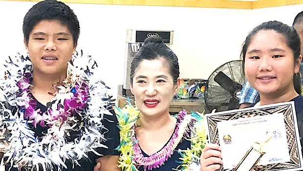 The Lo siblings — Michelle and Kevin — with local math instructor/ tutor Mrs. Seongshim Park 
