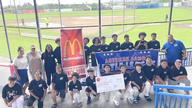 American Samoa little league players with McDonald's sign
