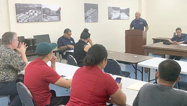 US Coast Guard Lt. Creighton C. Chong at the podium.