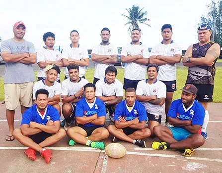 The men's rugby team poses for a group photo. 
