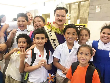 Reigning Miss American Samoa, Magalita Johnson with students.