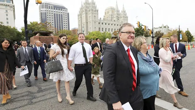People arrive for the twice-annual conference of The Church of Jesus Christ of Latter-day Saints Saturday, Oct. 6, 2018, in Salt Lake City