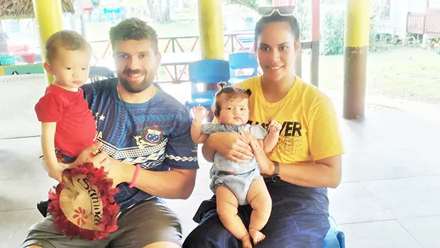 Ms Lautoo, husband and children