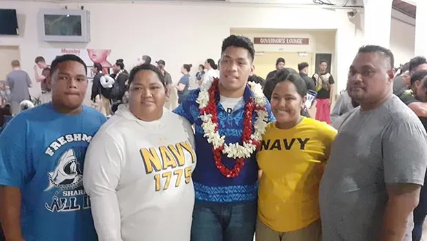 John Leulu with his parents and siblings