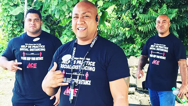 Three Neil’s ACE Home Center employees wearing social distancing t-shirts