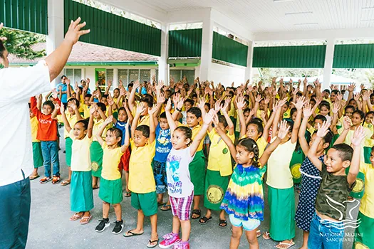 Students at Lauli`i Elementary School with a NMSAS staff member