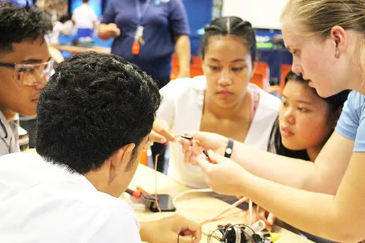 Pictured are some students from Samoana HS getting advice from a visiting Michigan student on starting their own underwater robotics teams.