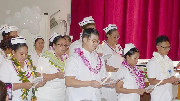 Seen in this Samoa News photo is the portion of the program with the “Lighting of Candles & Pledge” for the graduates, who will march tomorrow during the 73rd ASCC Graduation ceremony at the college campus. 