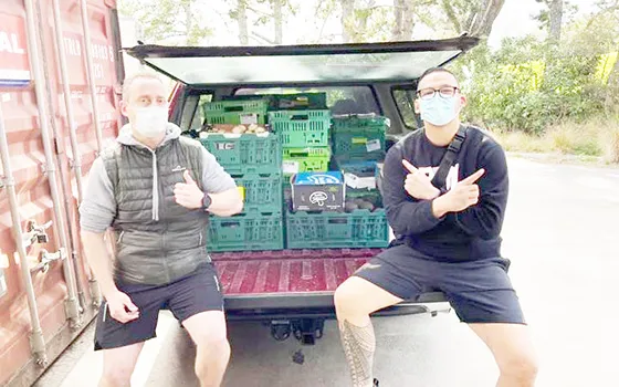 David Letele, right, and his food bank workers 