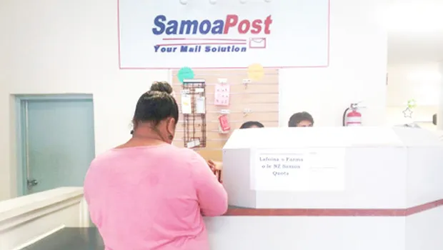  Applicant posting application form at the Samoa Post