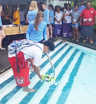 OJ Bartley of Faga'itua High School getting his hands and feet wet