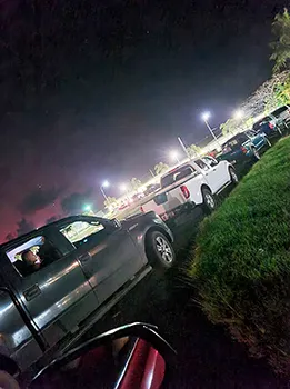 Cars lined up in the dark for vaccination drive thru