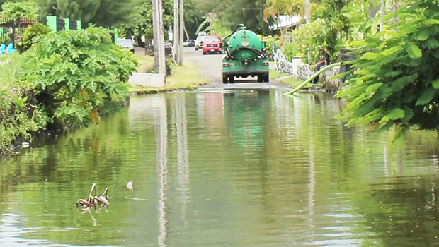 Pumper truck pumping out water at Fatuoaiga/Ottoville road