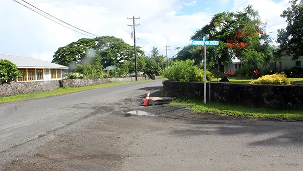 This Samoa News photo taken around 4p.m. last Friday, shows a corner section of Ottoville Road covered with gravel.