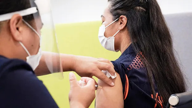 Woman getting a vaccination