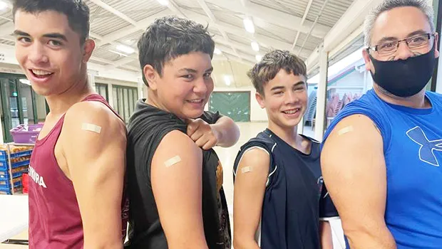 Pacific islanders showing off their vax