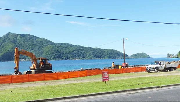 Park closed sign and red construction fencing along the shoreline