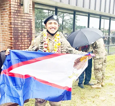 PFC Castro with American Samoa flag