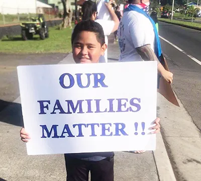 Young demonsrator at Saturday's rally for stranded residents.