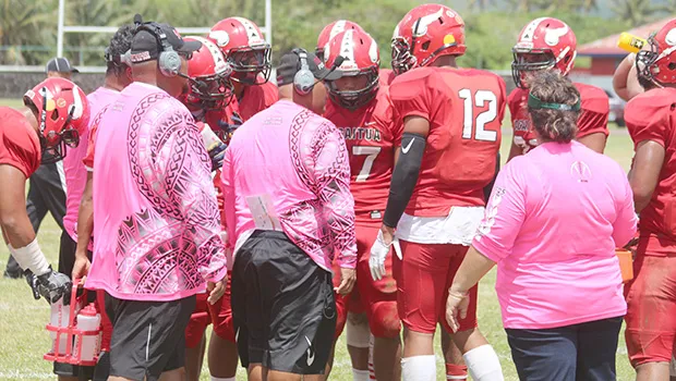Vikings coaching staff and the Warriors coaching staff in pink