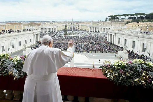 Pope Francis waves to an estimated 70,000 people