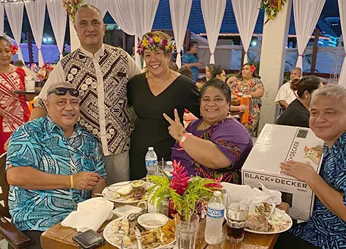 Taimalelagi Dr. Claire Poumele (right-standing), posing with others