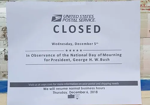 Sign at Post Office saying closed for National Day of Mourning 
