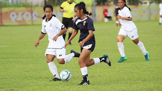 Precious Ieremia of American Samoa dribbles away