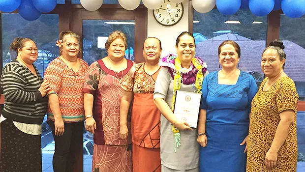 Manulele Tausala Elementary School principal, Martha Sagapolutele (third from right) with her award Certificate, after being named the “Principal of the Year” - school year 2017-2018.