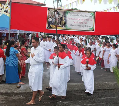 The start of the procession of worshiper from the Holy Family Parish in Fatuoaiga