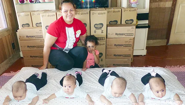 Maureen 12-pounds, Mariya 10-pounds, Melisha 12-pounds and Miracle 11-pounds with their mother and older sister