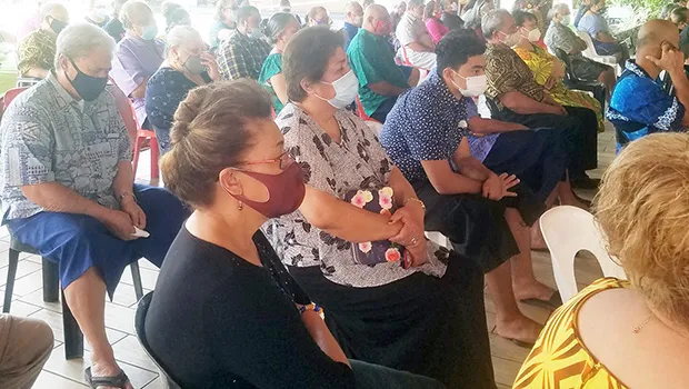 Repatriated residents at church service during quarantine at Tradewinds hotel