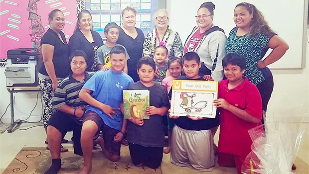 People participating in Lupelele Elementary’s Read Aloud program 