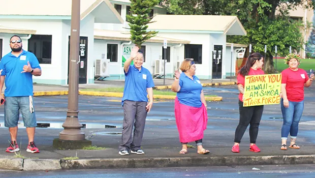 Repatriation passengers at thank you wave