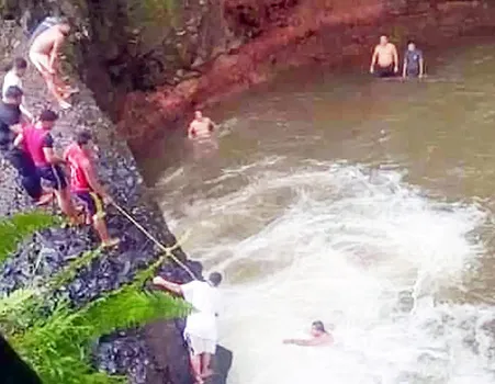 Rescuers attempting to locate Perez after he dived into the pool at Togitogiga Falls