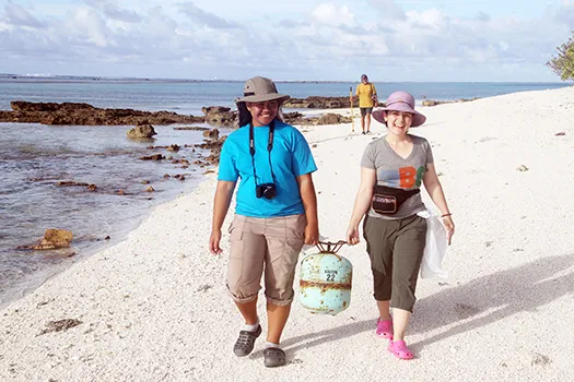 Former ASCC student Aveipepa Fua (left) escorts Laura Fong of the PBS New Hour 