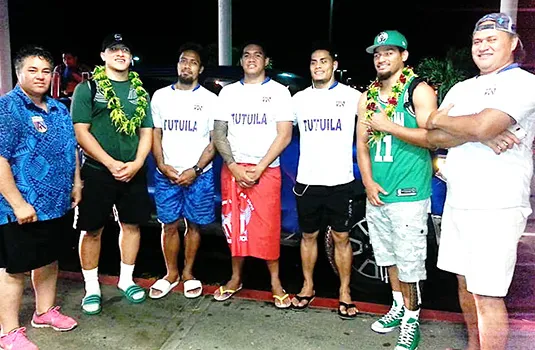 Talavalu players, with head coach Tommy Elisara (far right) and team manager Annie Coffin (far left).