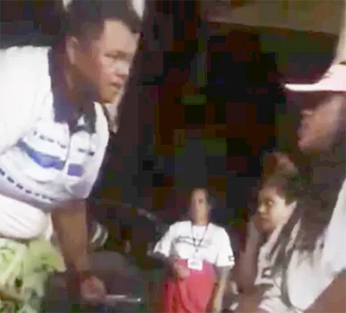 This photo is a screenshot from the video, showing head coach Annie Coffin - who is also a DPS police officer - addressing one of her players, only seconds before she allegedly put her hands on her.
