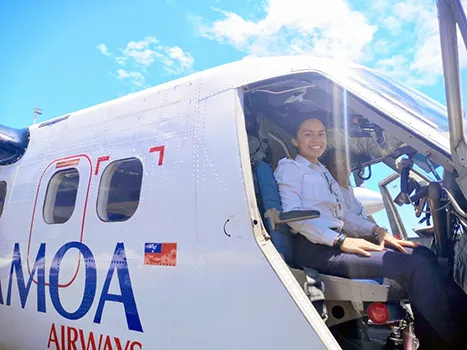 Fanaafi Sooaemalelagi, looking at the camera from inside the cockpit of the airline’s aircraft 